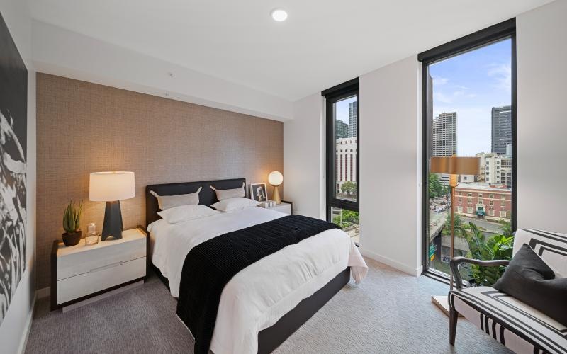 a bedroom with a bed and two nightstands