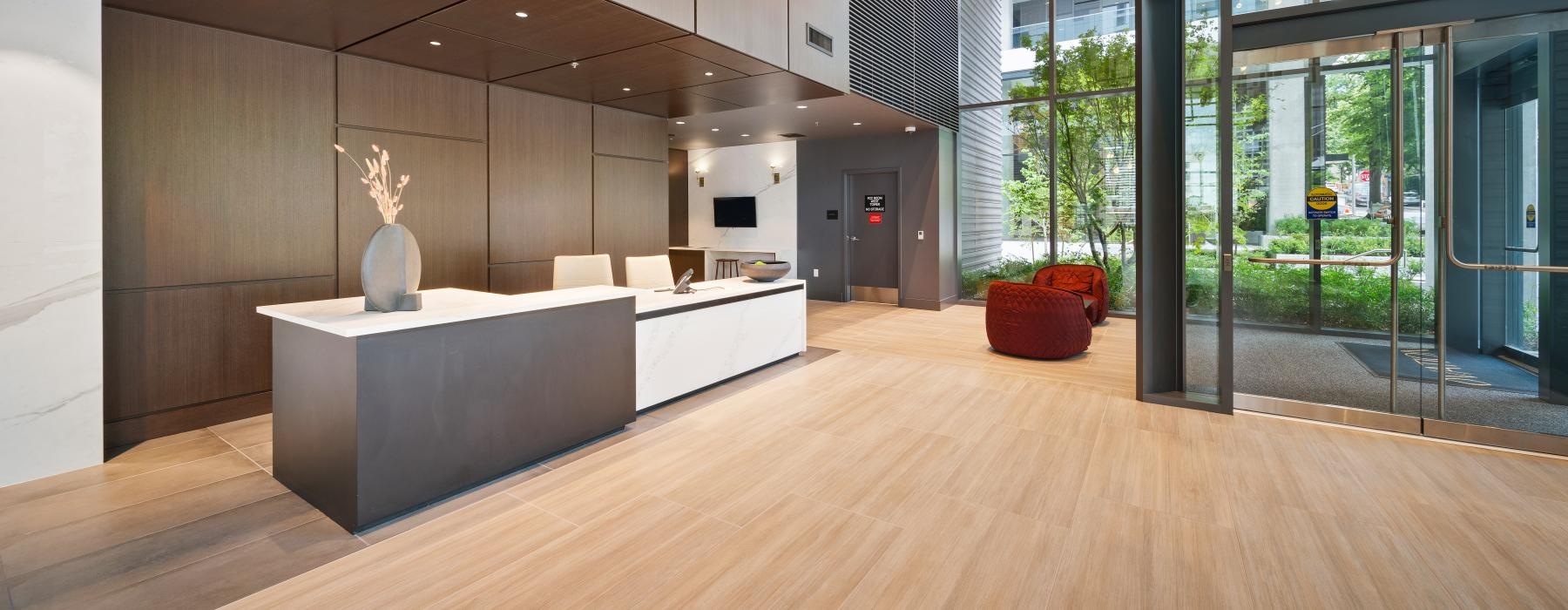 a leasing front desk with a couch and a table